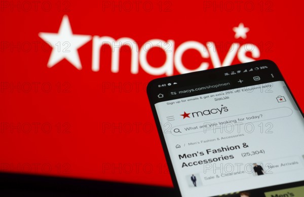 Dhaka, Bangladesh- 03 July 2025: Smartphone displaying Macy's web interface against Macy's logo background