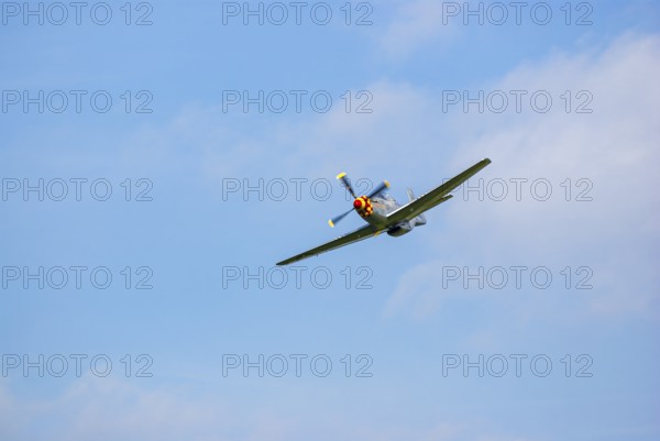 A North American P-51 Mustang of the flying group Flying Bulls, the Nooky Booky IV during an air show at the Rossfeld in Metzingen-Glems, Baden-Württemberg, Germany, for editorial use only