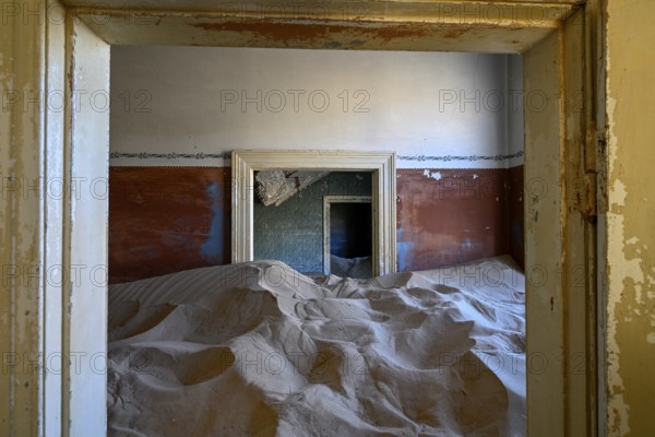 Sand mountains in a former dwelling house, interior photograph, Kolmanskop, restricted diamond area, near Lüderitz, Karas region, Namibia