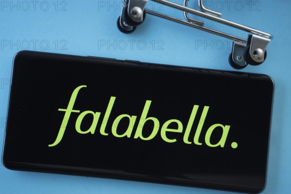Dhaka, Bangladesh- 03 Oct 2025: Smartphone screen showing the Falabella. logo with shopping cart wheels on a blue background