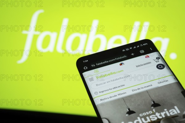Dhaka, Bangladesh- 03 Oct 2025: Smartphone displaying Falabella. web interface against Falabella. logo background