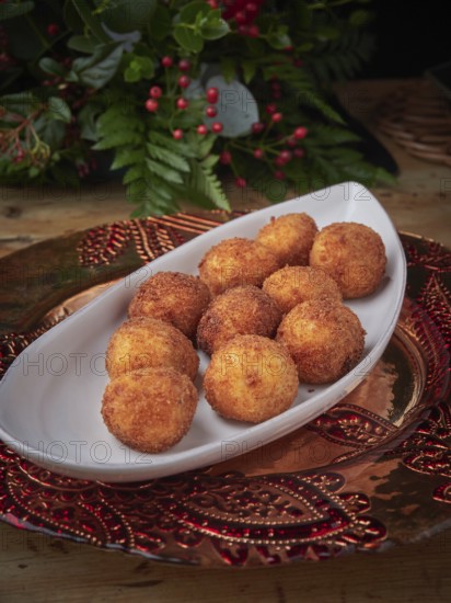 Delicious golden croquettes plating on a christmas holiday table