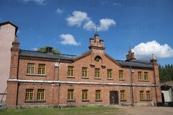 Brick façade with inscription Werla, former paper factory and mill for the production of groundwood pulp board, UNESCO World Heritage Site Factory Village Verla, Maailmanperintökohde Verlan puuhiomo ja pahvitehdas, Verla Rapids, Kymenlaakso, near Kouvola, Finland