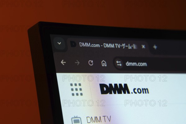 Dhaka, Bangladesh- 03 Oct 2025: Close-up of a computer screen displaying the Dmm.com web interface in dark mode