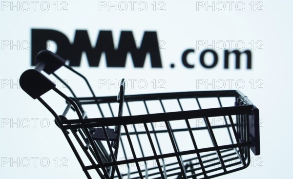 Dhaka, Bangladesh- 03 Oct 2025: Silhouette of a shopping cart in front of the Dmm.com logo, symbolizing ecommerce and online shopping