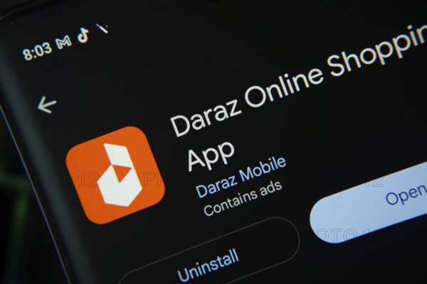 Dhaka, Bangladesh- 03 Oct 2025: Screen displaying Daraz app with open and uninstall options, dark interface