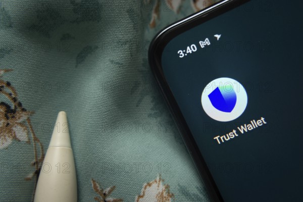 Dhaka, Bangladesh- 30 Sep 2025: Trust Wallet app icon is seen on smartphone