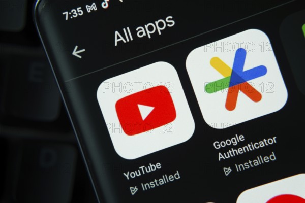 Dhaka, Bangladesh- 27 July 2025: Youtube, Google Authenticator app from Google Playstore is displayed on a smartphone screen