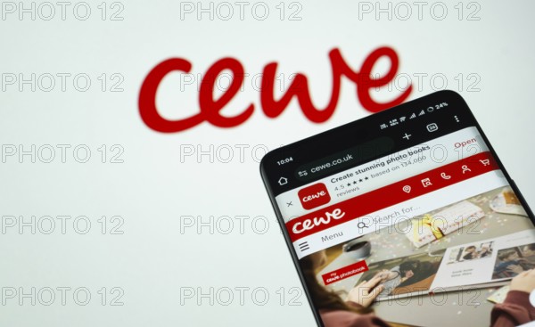 Dhaka, Bangladesh- 03 July 2025: Smartphone displaying Cewe web interface against cewe logo background