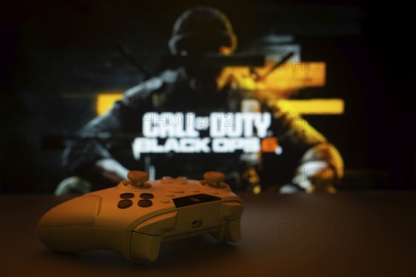 Dhaka, Bangladesh- 06 Sep 2025: A close-up of a white gamepad with Call of Duty Black Ops 6 seen on screen in the background