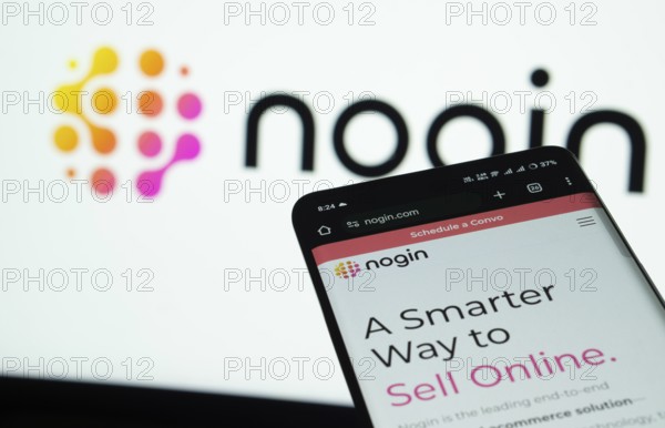 Dhaka, Bangladesh- 03 July 2025: Smartphone displaying nogin web interface against nogin logo background