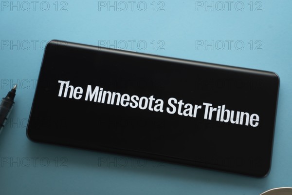 Dhaka, Bangladesh - 18 March 2025: The logo of The Minnesota star tribune is displayed on a smartphone screen
