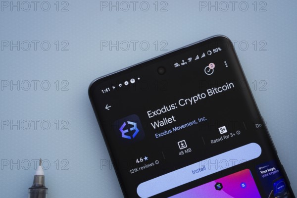 Dhaka, Bangladesh- 29 May 2025: On a blue surface, a smartphone displays the Exodus app within the Google Play Store