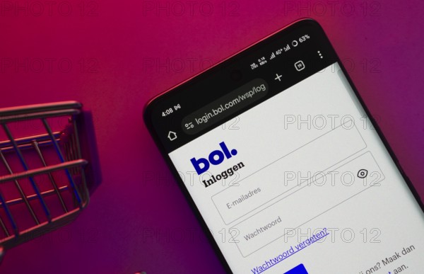 Dhaka, Bangladesh- 23 June 2025: A smartphone displaying the bol website with a shopping cart is shown on a vibrant background