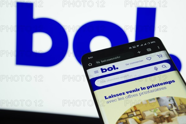 Dhaka, Bangladesh- 03 July 2025: Smartphone displaying bol web interface against bol logo background