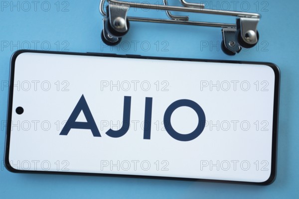 Dhaka, Bangladesh- 03 July 2025: Smartphone screen showing the AJIO logo with shopping cart wheels on a blue background