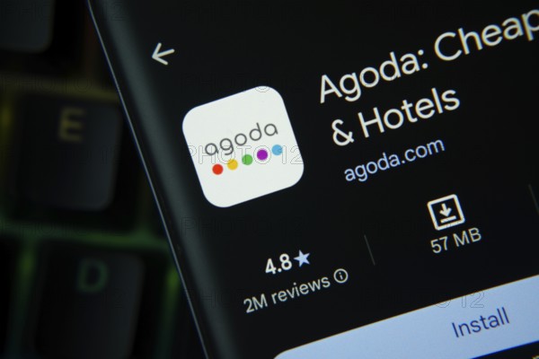 Dhaka, Bangladesh- 27 July 2025: Agoda app from Google Playstore is displayed on a smartphone screen