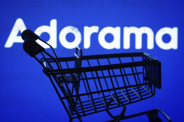 Dhaka, Bangladesh- 03 July 2025: Silhouette of a shopping cart in front of the Adorama logo, symbolizing ecommerce and online shopping