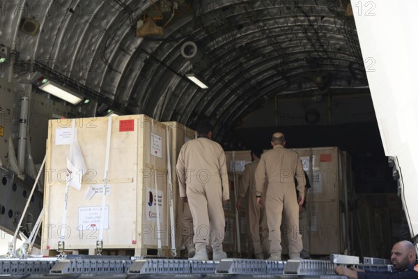 Members of the Qatari Air Force unload humanitarian aid supplies from a transport aircraft at Damascus International Airport as part of Qatar's air and land relief bridge to Syria, Damascus, Damascus, Syria