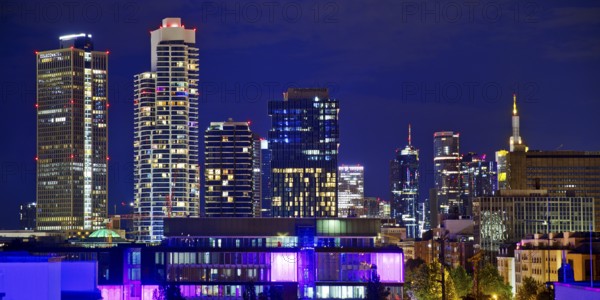 Rooftop day with colourfully illuminated houses for a techno party on the roof with a view of the skyline, Frankfurt am Main, Hesse, Germany