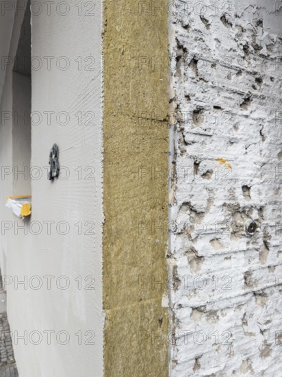 The façade of an apartment building is being energetically renovated with mineral wool insulation boards, Düsseldorf, Germany