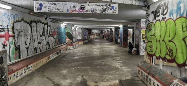 Graffiti-decorated tunnel with colorful murals and urban atmosphere, subway station, Lisbon, Portugal