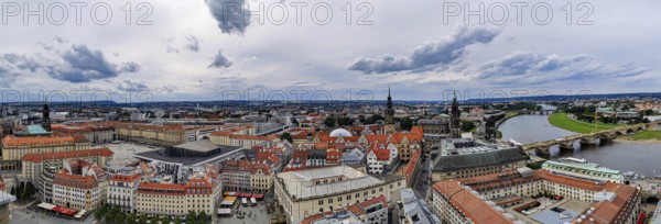 City panorama of Dresden, with river, bridge and distinctive architectures under cloudy sky, Dresden