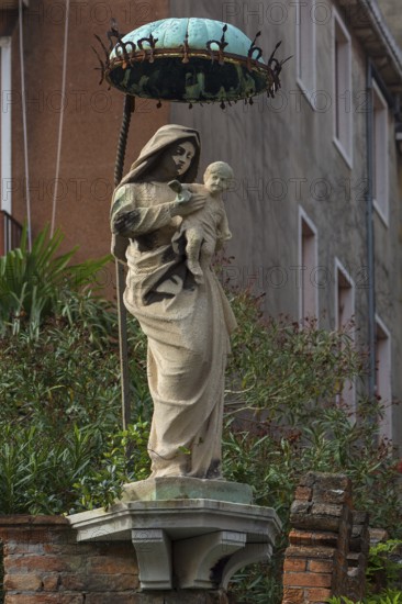 Statue of the Virgin with Christ Child under a canopy, Venice, Veneto, Italy