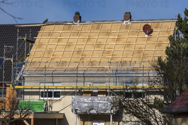 Roof insulation of an old apartment building, Bavaria Germany
