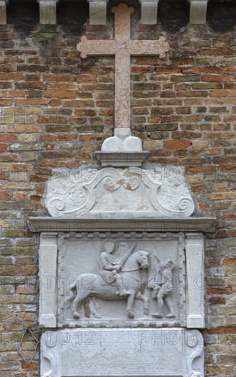 Bas-relief on the church of San Martino Vescovo from 1534, Saint Martin sharing his mantle to the poor, Venice, Veneto, Italy