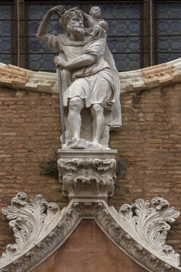 Sculpture of Christopher above the entrance portal of the Madlonna dell'Orto parish church, around 1400, Venice, Veneto, Italy