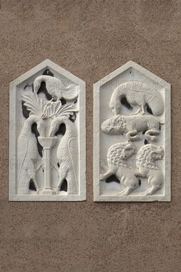 Animal reliefs on a house wall, Venice, Veneto, Italy