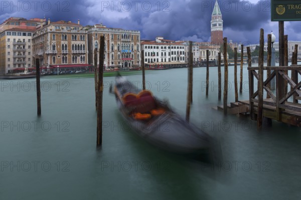 Gondola anchored in the Grand Canal, St Mark's Campanile in the back, Venice, Veneto, Italy