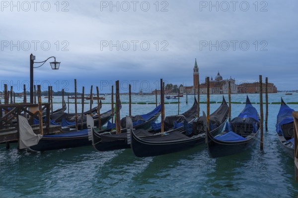 Anchorage for gondolas, at the back the island of San Giorgio Maggiore, Venice, Veneto, Italy