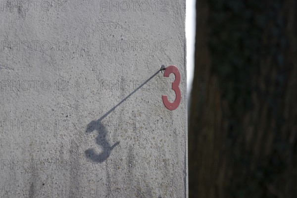 Three, number, house number, shadow, outside, The number 3 appears twice because the attached number casts a shadow on the bright wall