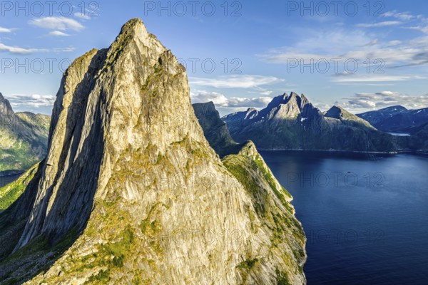 Aerial view of Mt. Segla, in the back Mt. Breidtinden, Senja Island, Norway
