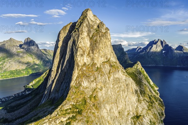 Aerial view of Mt. Segla, in the back Mt. Grytetippen (left) and Mt. Breidtinden, Senja Island, Norway