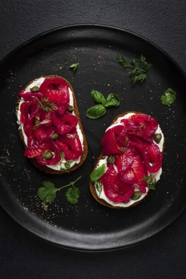 Sandwiches with gravlax salmon, cream cheese, capers, greens, breakfast, homemade
