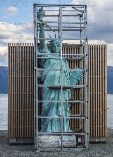 Art object, Statue of Liberty in a cage, village Lyngen, Lyngen Alps, Norway