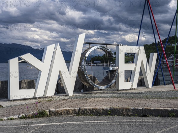 Letter sculpture with the name of the village of Lyngen, Lyngen Alps, Norway