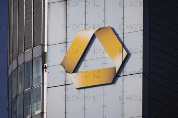 The sun shines on the logo of Commerzbank, Frankfurt am Main, Hesse, Germany
