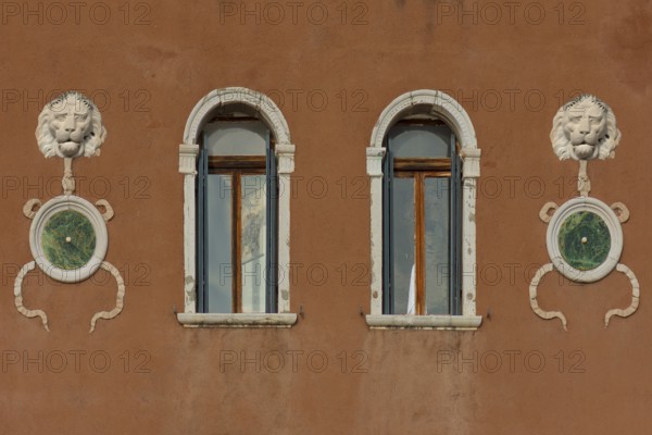 Lion heads at a palace, Venice, Veneto, Italy