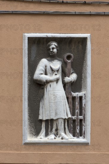 Relief of a male figure on a residential building, Venice, Veneto, Italy