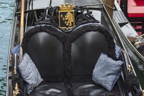 Comfortable black leather seats in a gondola, Venice, Veneto, Italy