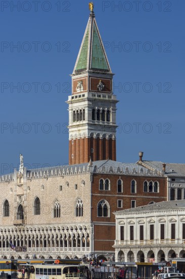 Spire of St. Mark's Campanile, in front the Doge's Palace, blue sky, Venice, Veneto, Italy