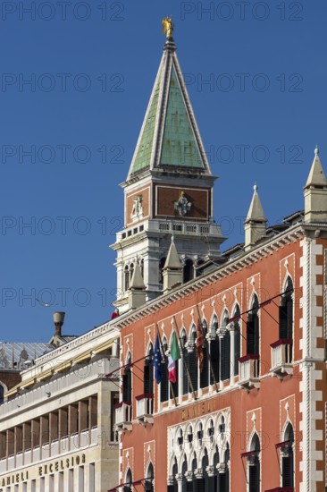 Tower of St. Mark's Campanile, in front the 5 star Hotel Danieli, blue sky, Venice, Veneto, Italy