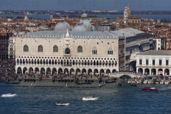 Doge's Palace with Bridge of Sighs, domes of St. Mark's Basilica, Grand Canal in front, Venice, Veneto, Italy