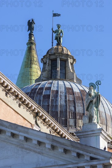 Bronze figures on the towers of the church of San Giorgio Maggiore, Venice, Veneto, Italy