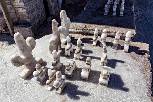 Salt chess pieces on a board in a detailed, bright desert setting, salt sculptures in the Salar de Cauchari salt pan near Salta in Argentina