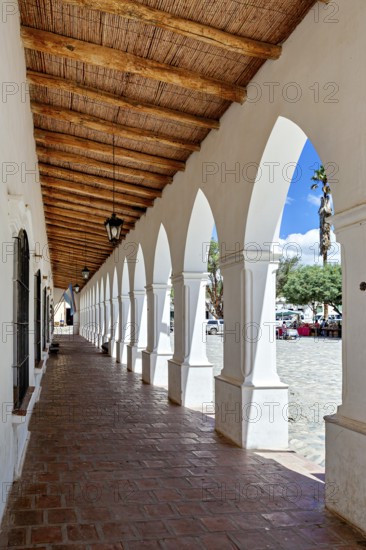 Colonial arcade series with wooden roof, opens to a public square, The arcades of Cachi in Argentina